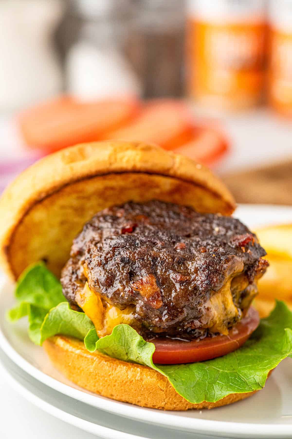 Stuffed Bacon Cheeseburger on toasted slice bun on plate