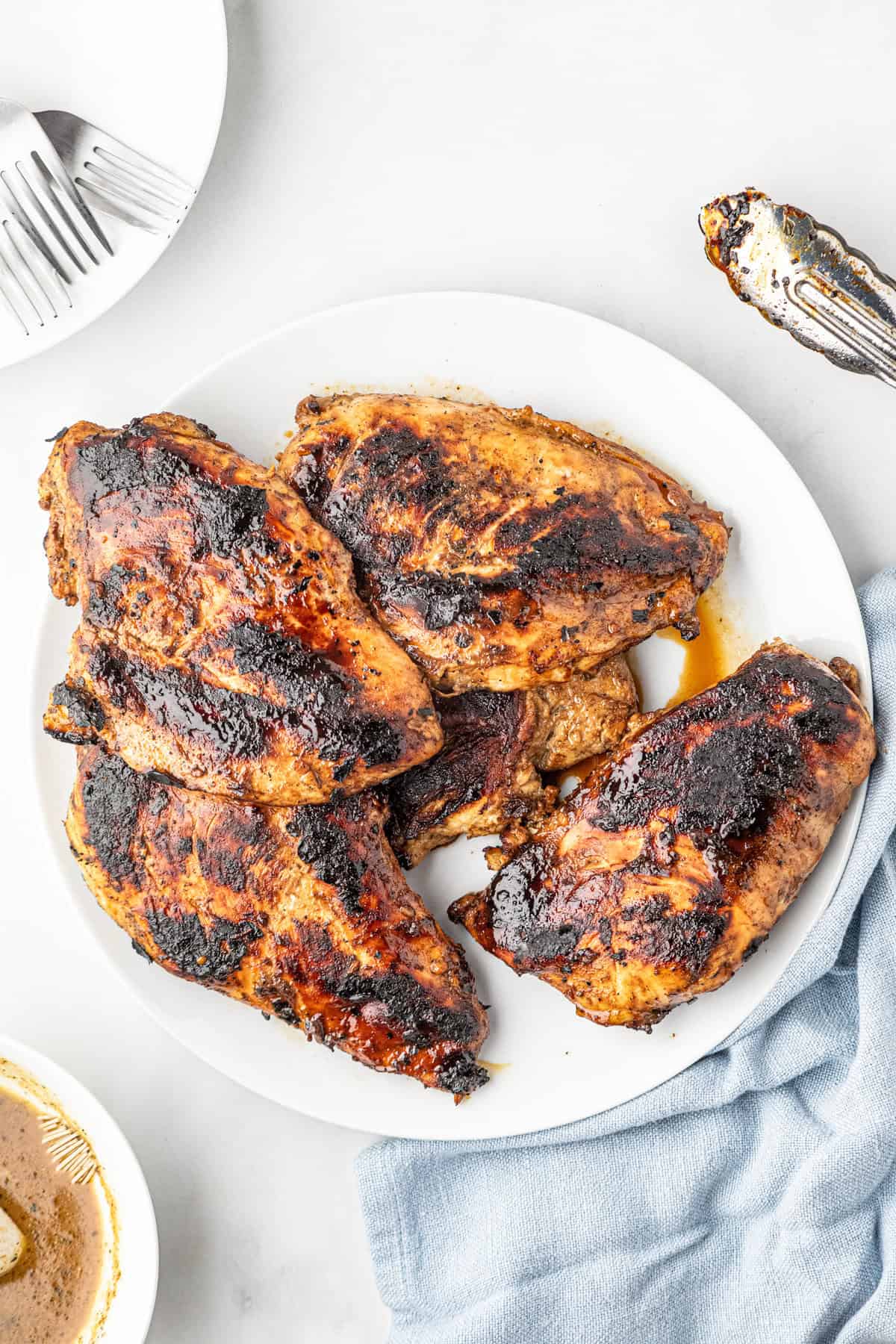 Cooked chicken in Chicken Marinade on serving blate