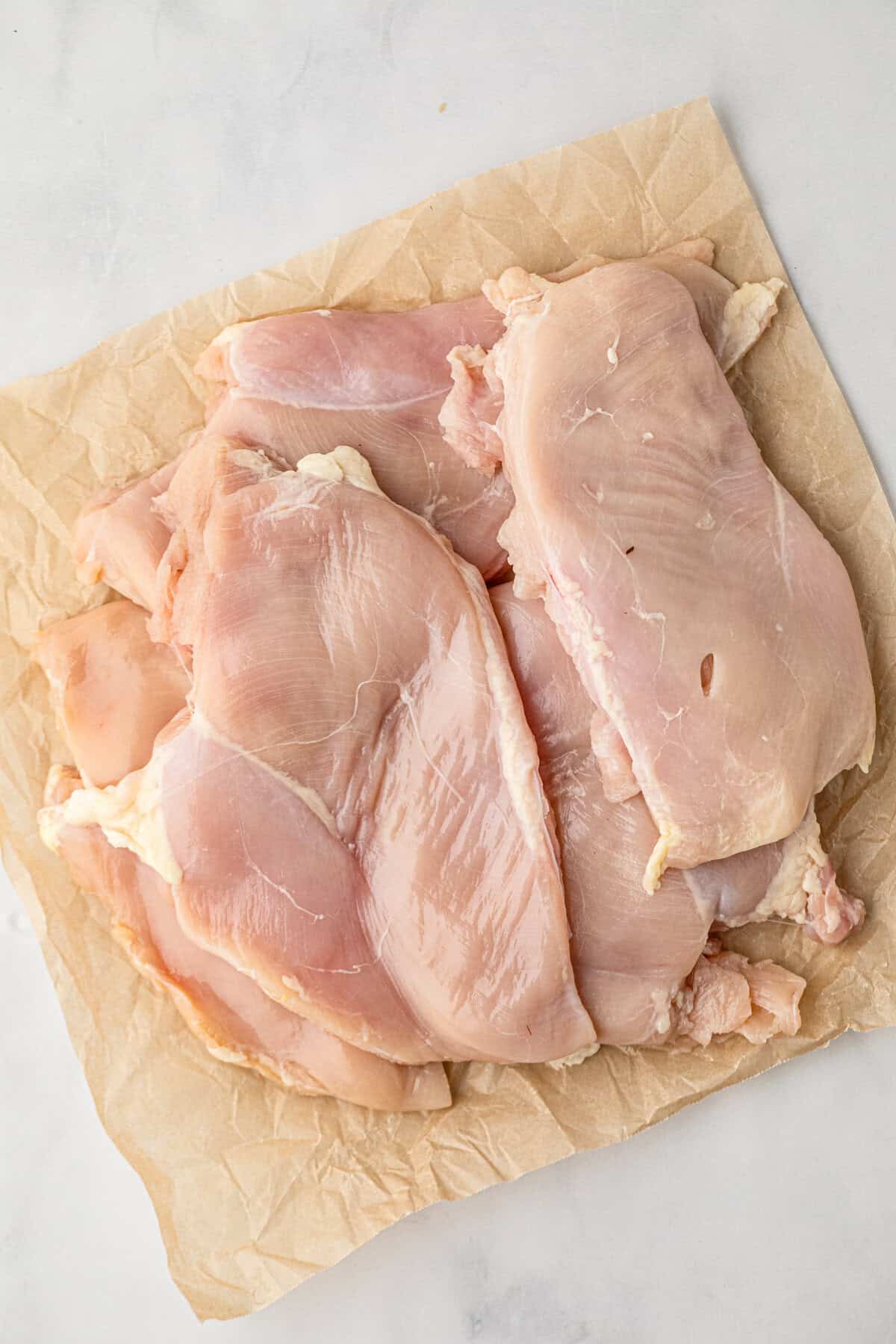Boneless chicken breasts for Chicken Marinade recipe on cooking paper