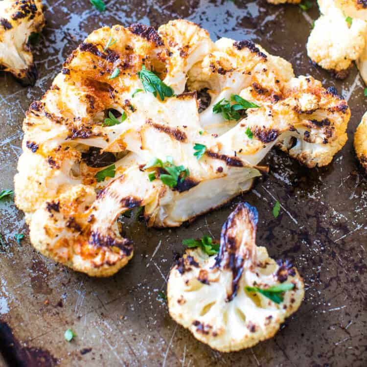 Overhead image of Grilled Cauliflower Steak on sheet pan