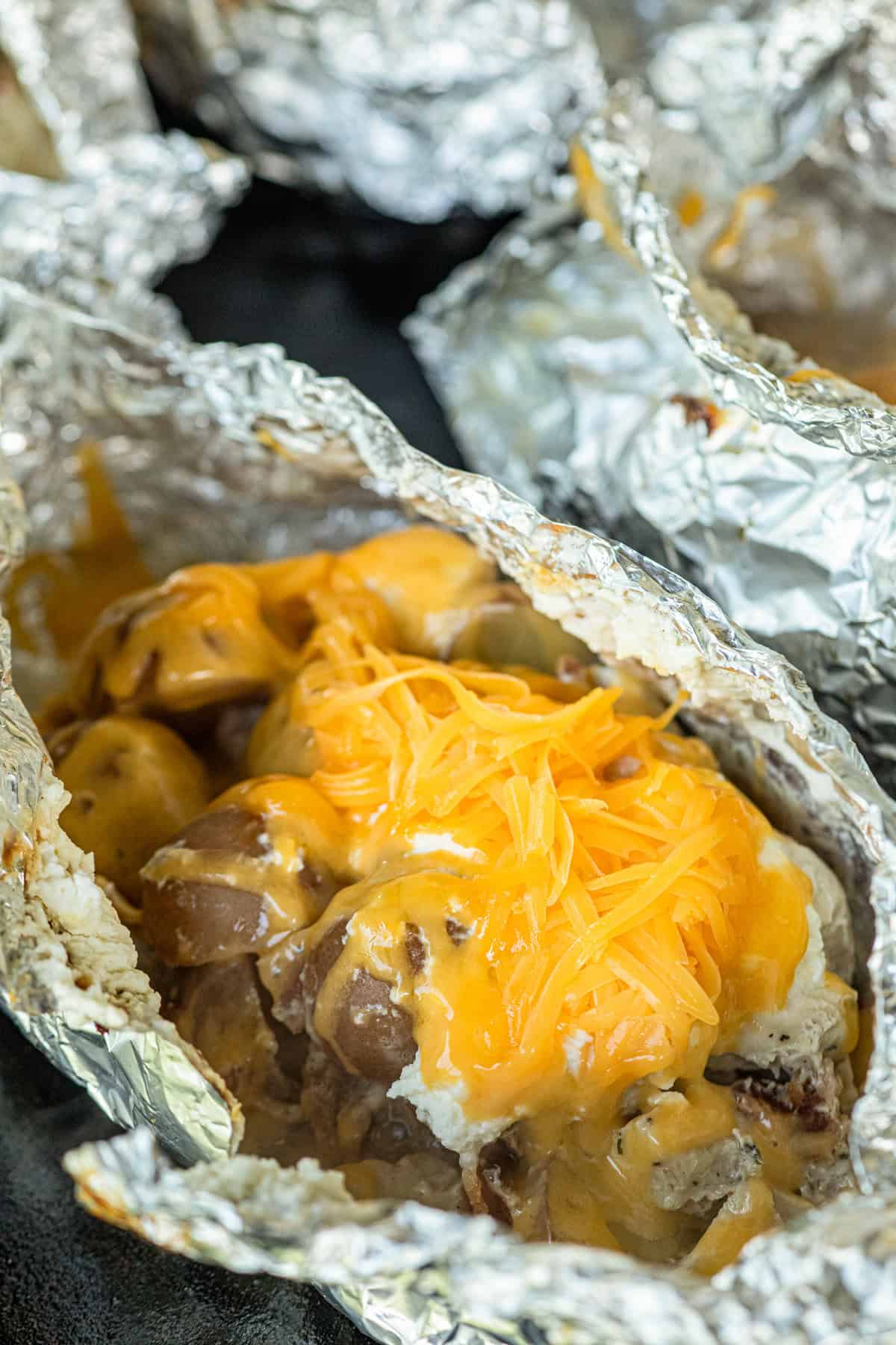 Adding shredded cheese to Crack Chicken Foil Packet