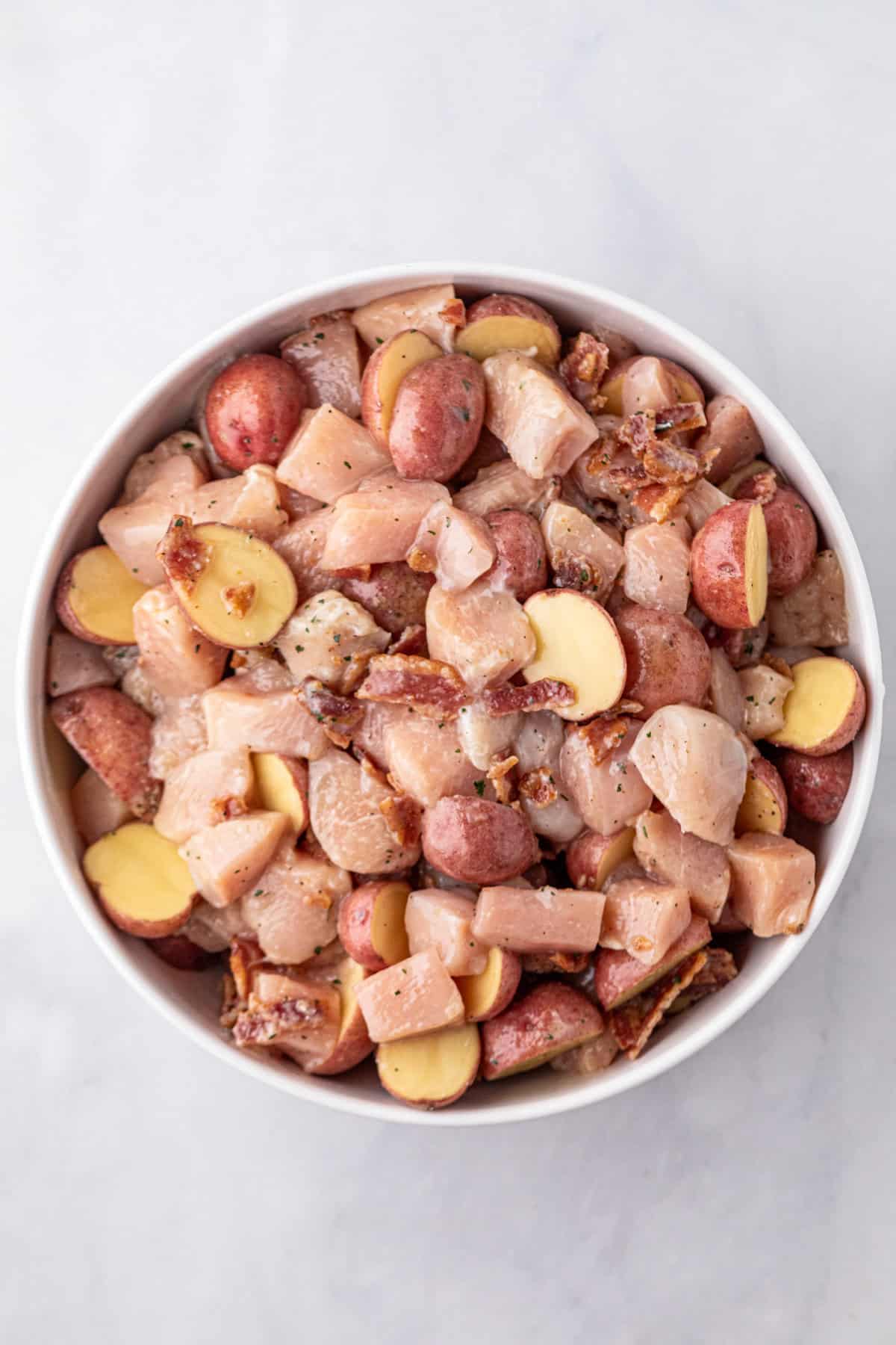 Cut and prepared Crack Chicken Foil Packets ingredients in large mixing bowl
