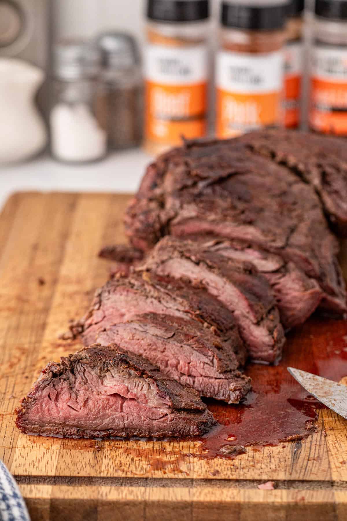 Smoked Beef Tenderloin sliced on cutting board