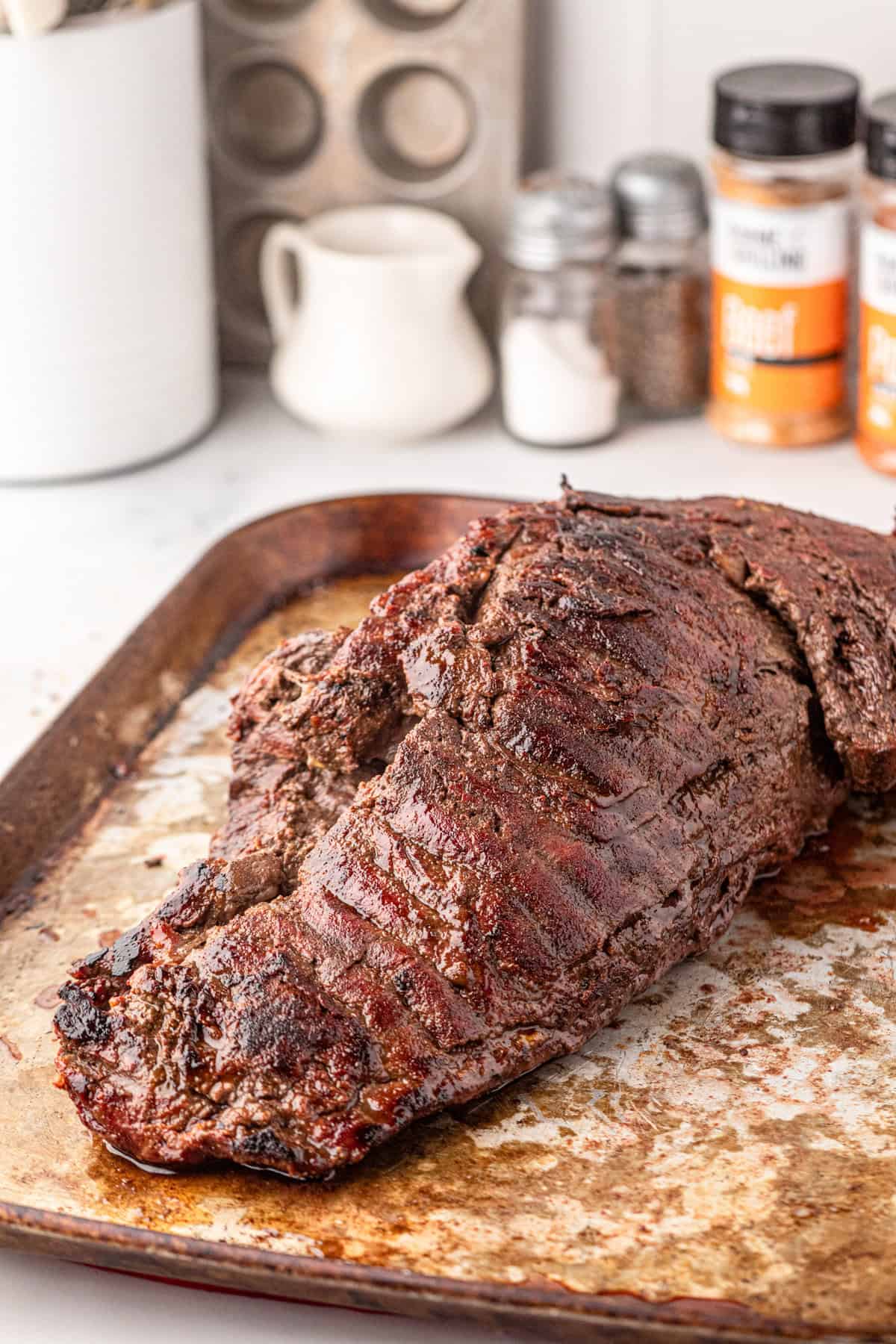 Allowing Smoked Beef Tenderloin to rest on cooking sheet prior to slicing