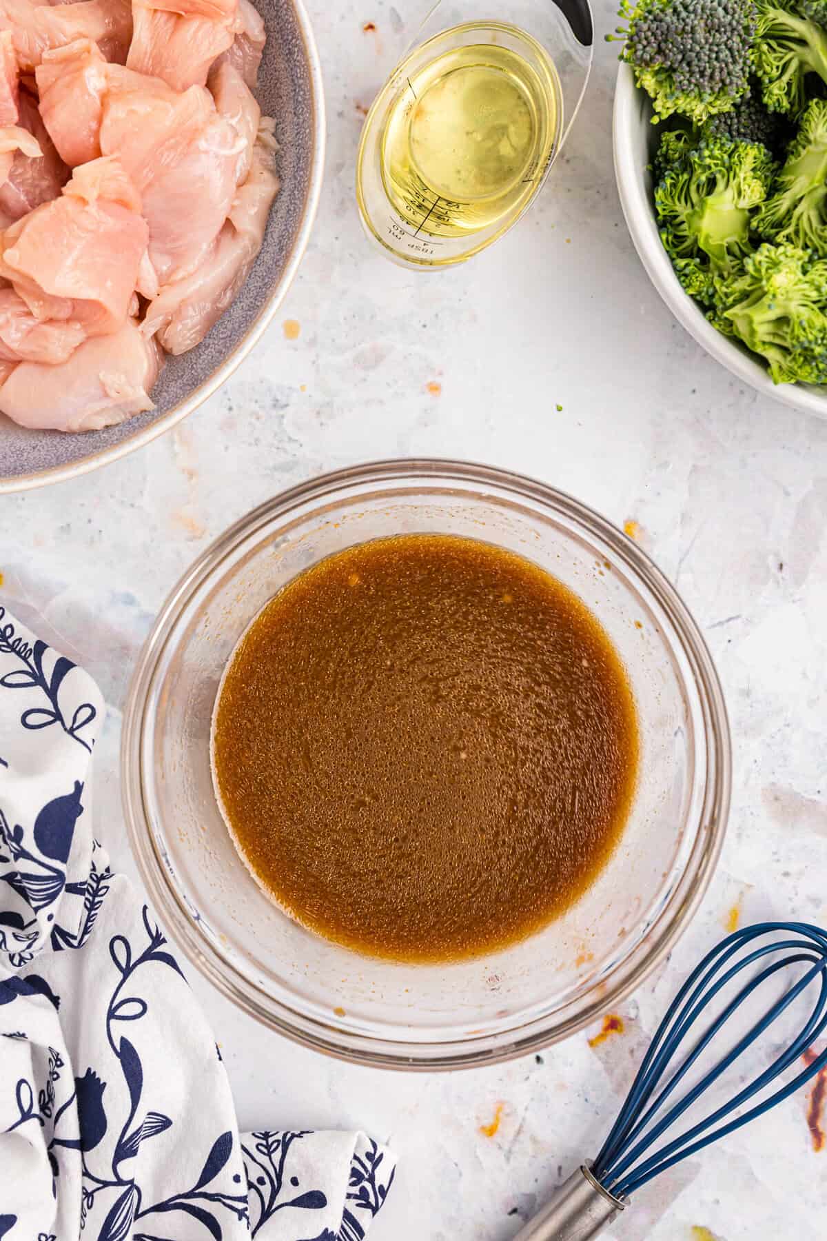 Blackstone Chicken Stir Fry sauce in mixing bowl blended with a whisk