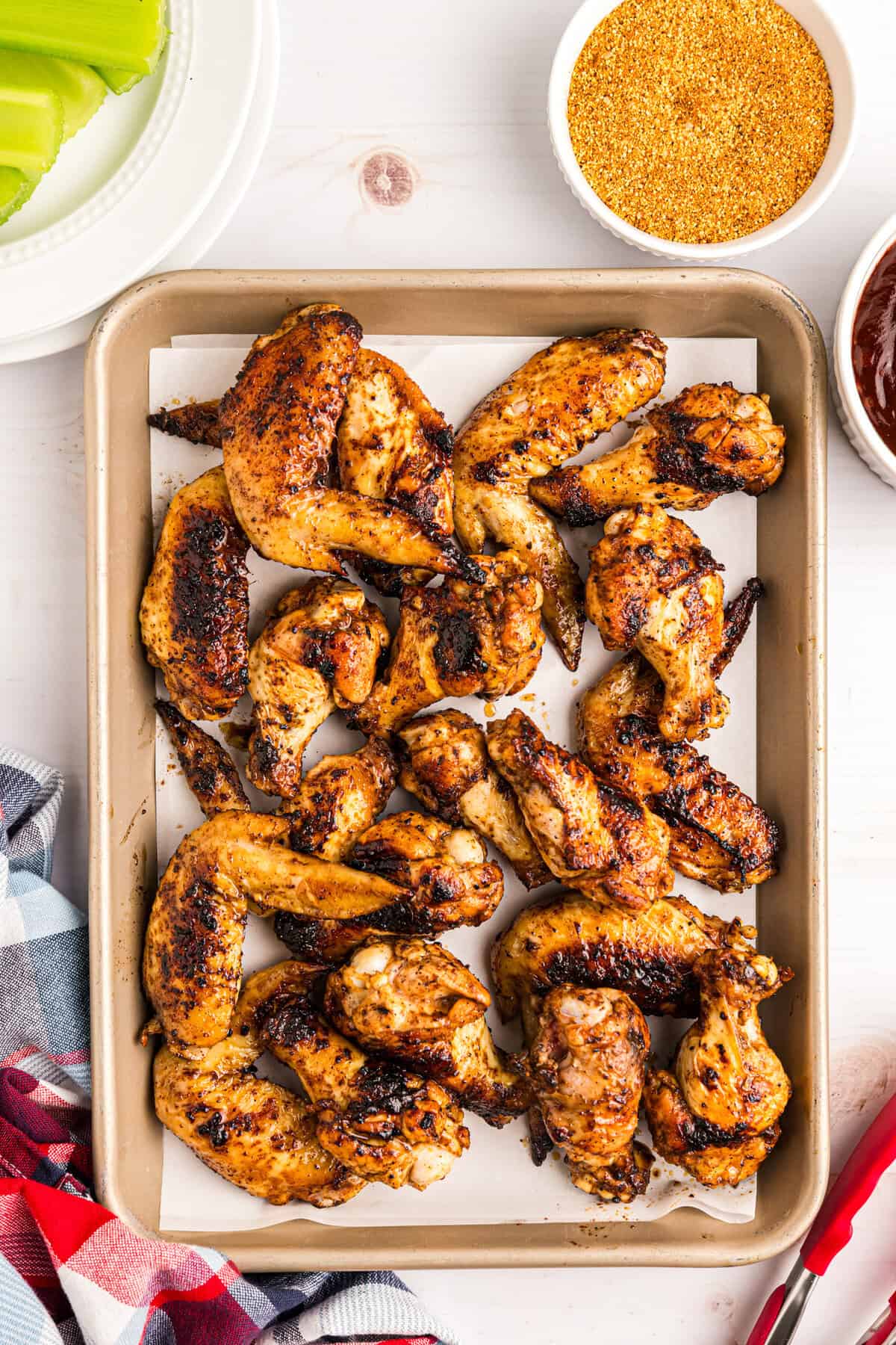Blackstone Chicken Wings on parchment lined cooking sheet