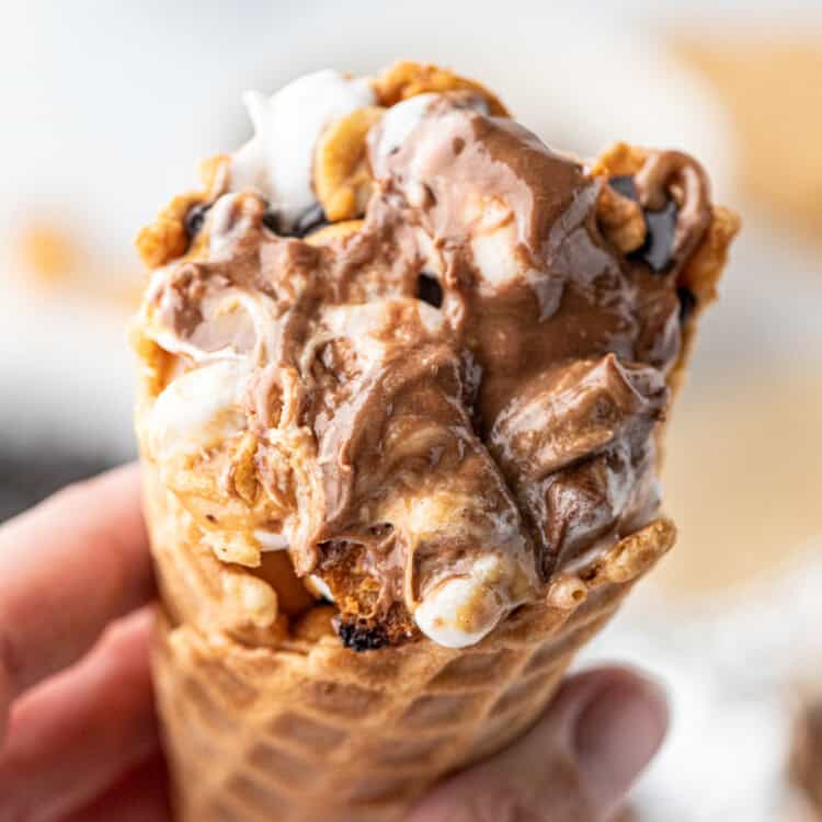 Campfire Cones hot off the grill with one hand holding it