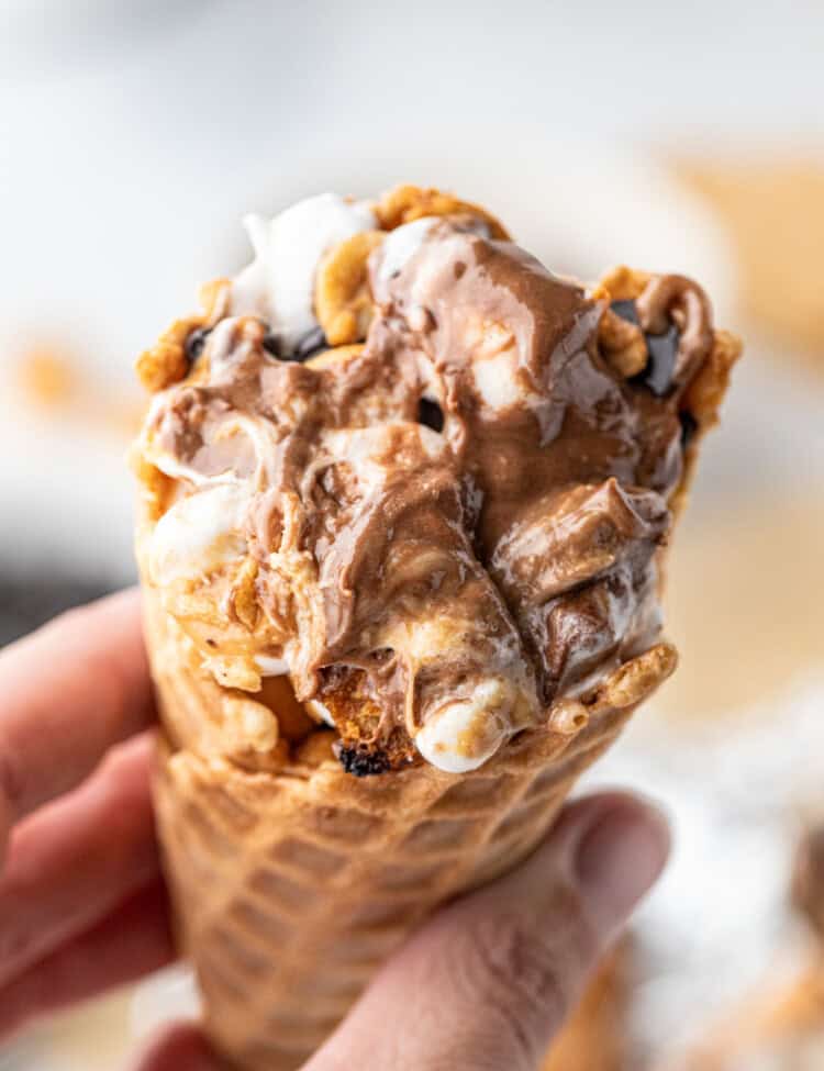 Campfire Cones hot off the grill with one hand holding it