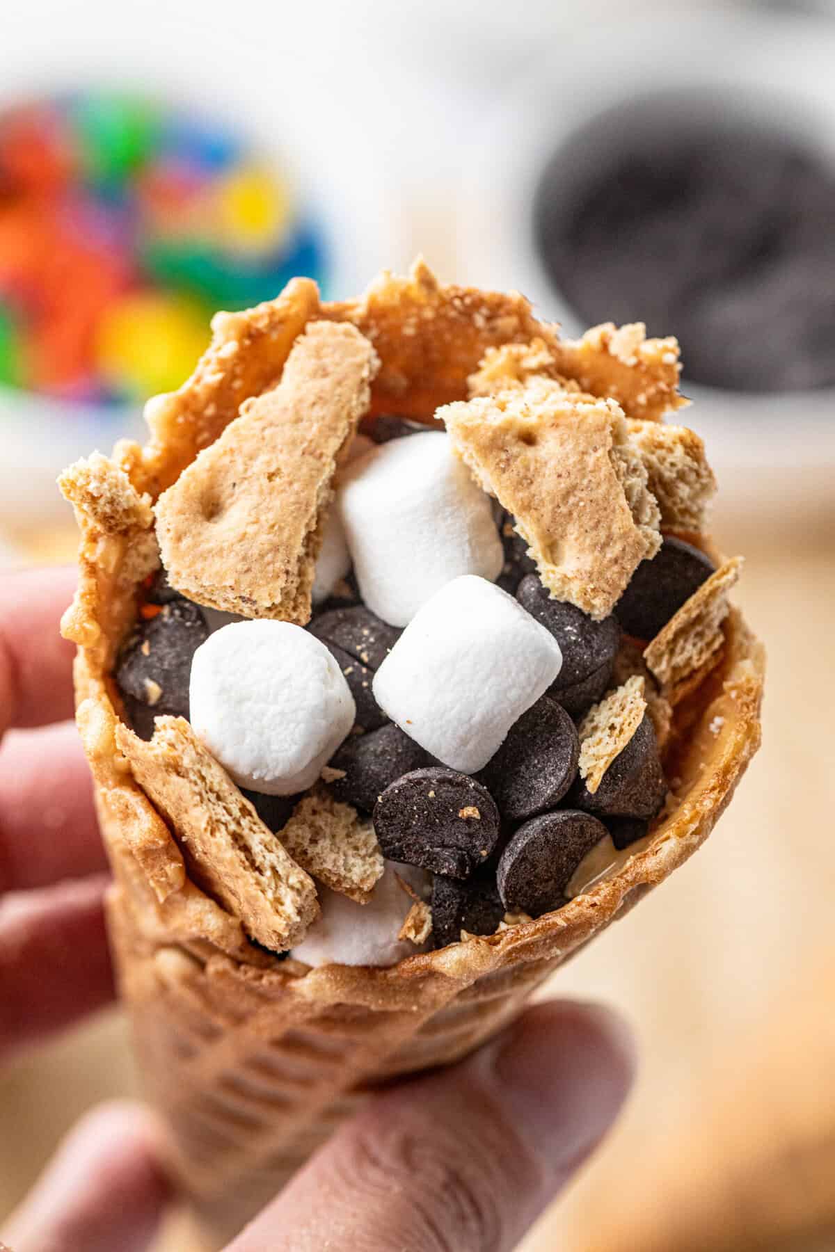 Stuffed waffle cone with ingredients for Campfire Cones