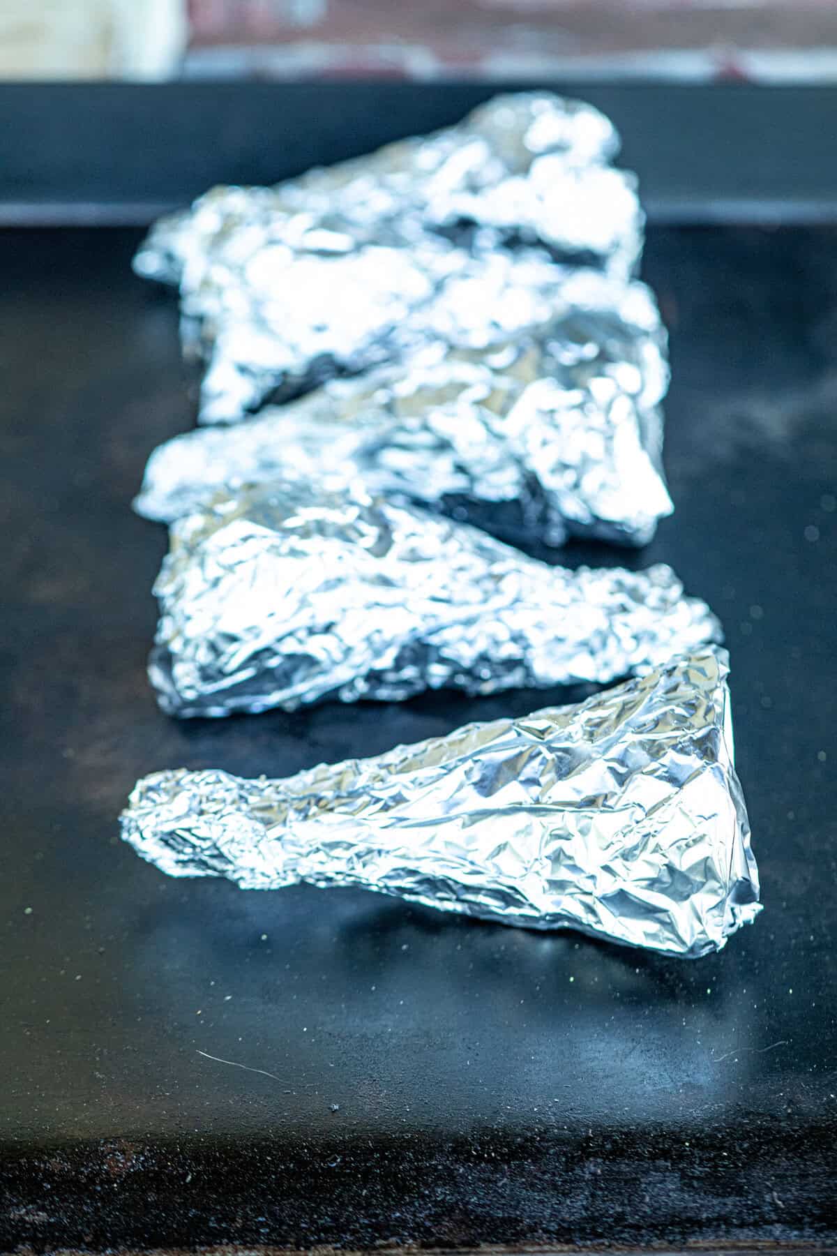 Foil wrapped Campfire Cones on the Blackstone
