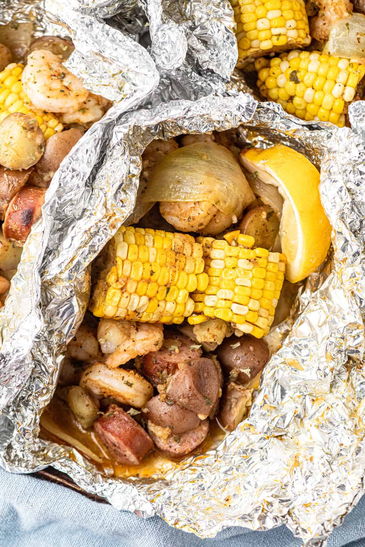Shrimp Boil Foil Packets Ingredients peeled open after cooking