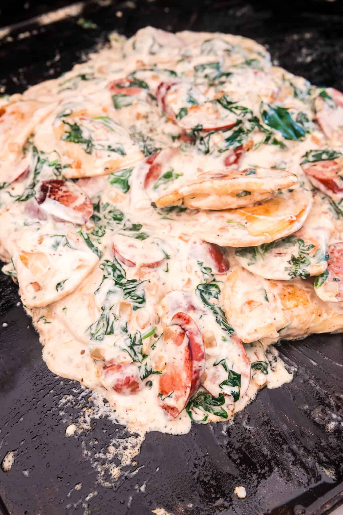 Perfectly blended Blackstone Sausage and Pierogies on the griddle