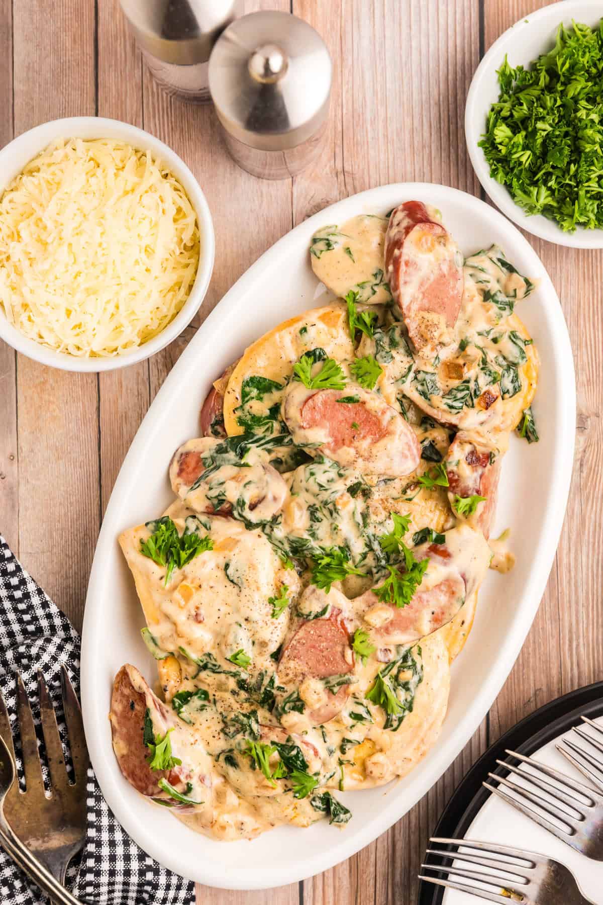 Blackstone Sausage and Pierogies in shallow white serving dish