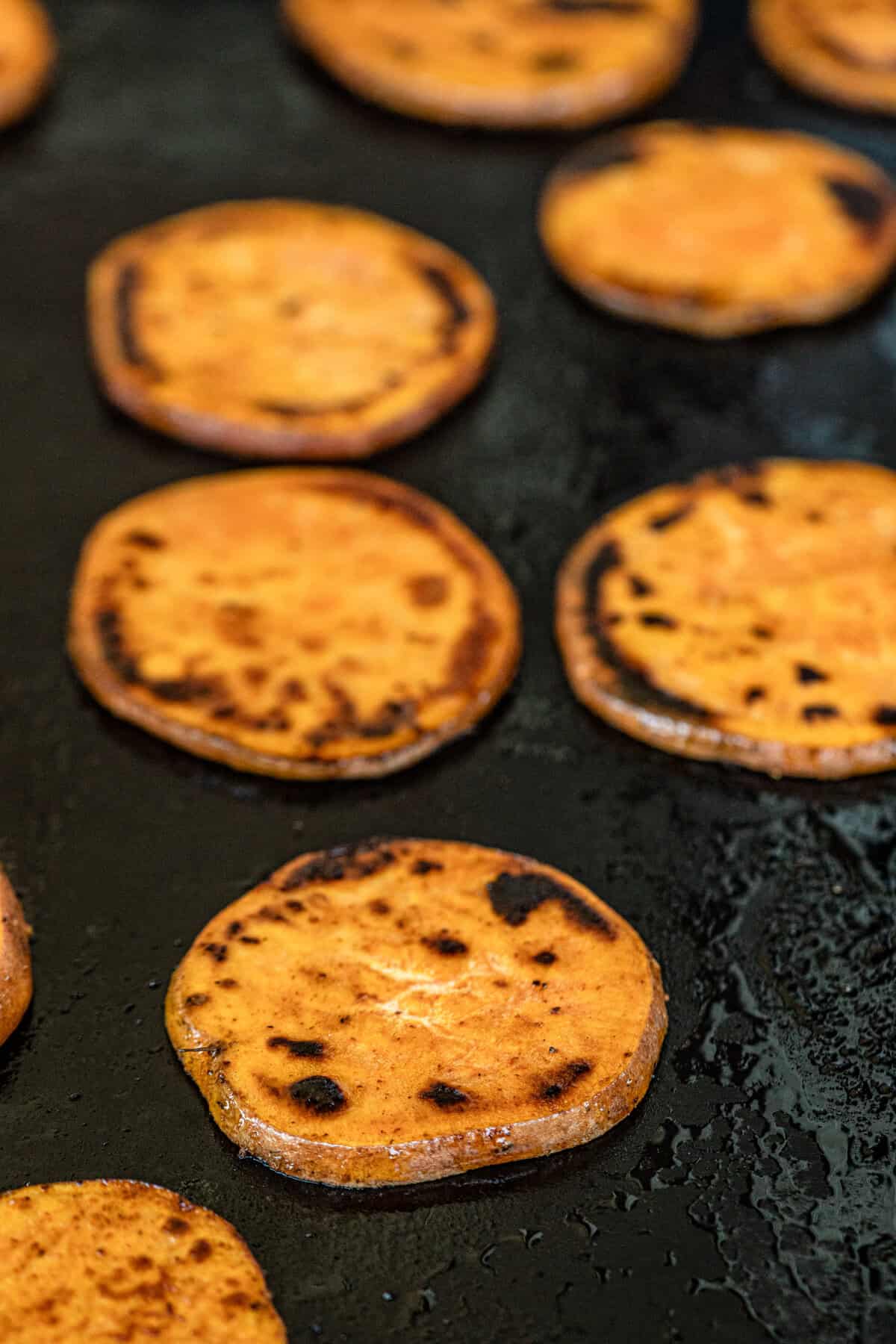 Grilled Sweet Potatoes browned to perfection on the gril