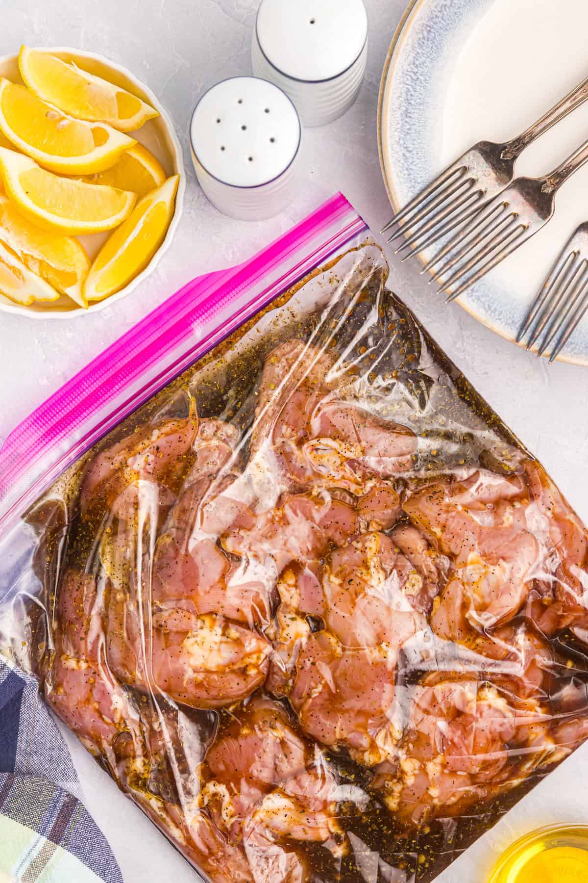 Using large zip lock bag to marinate meat for Blackstone Chicken Thighs