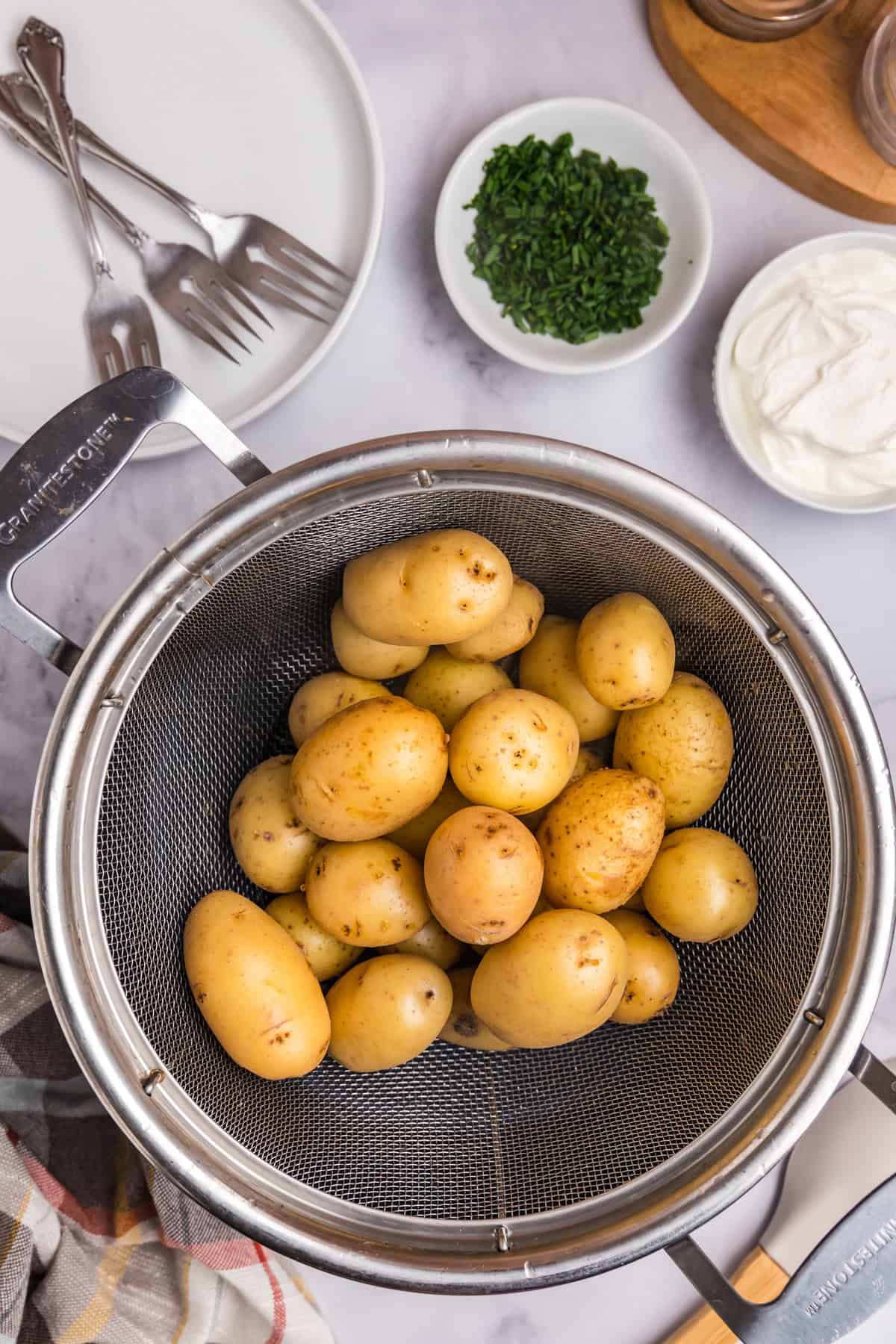 Boiling small potatoes in stock pot for Blackstone Loaded Smashed Potatoes recipe