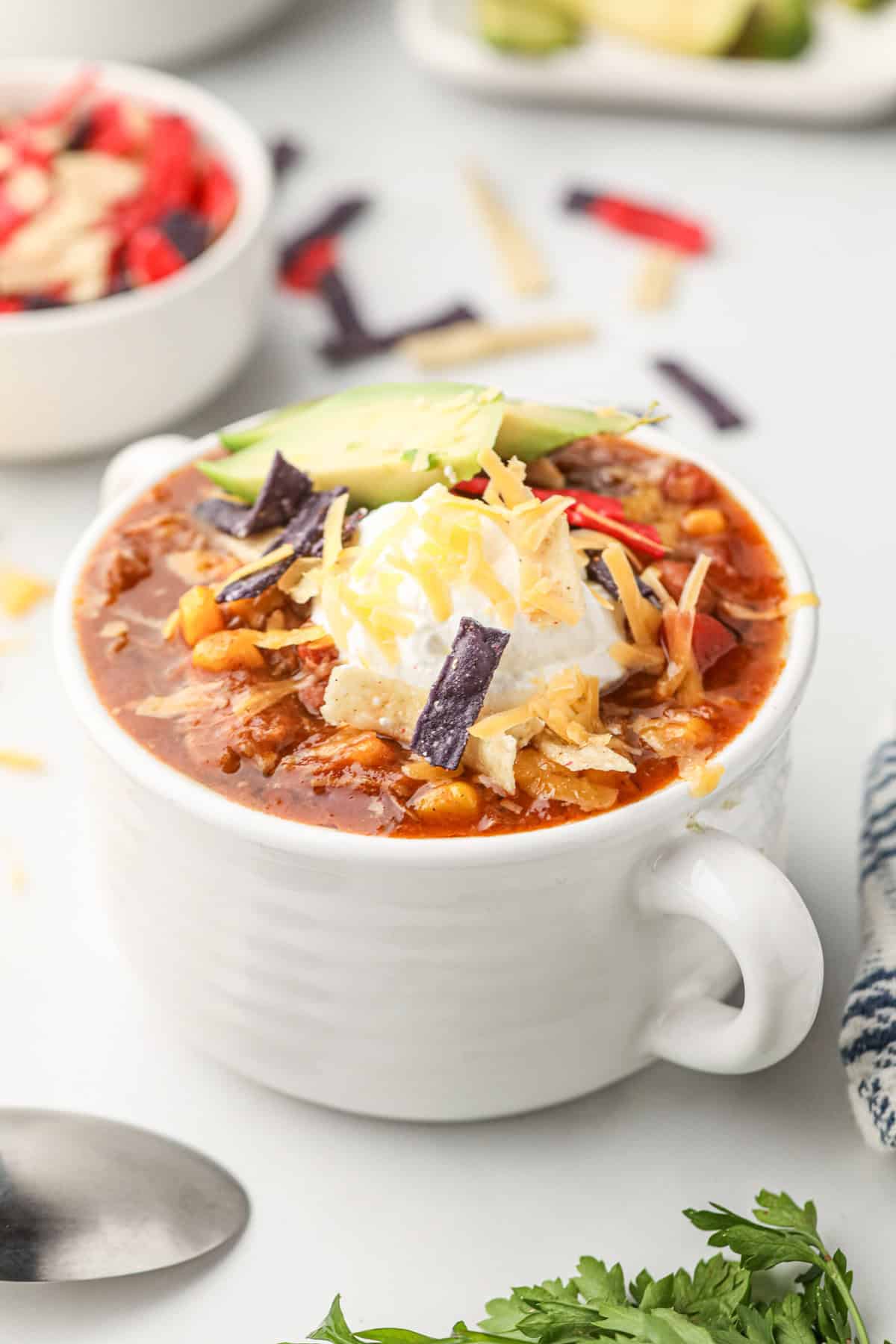 Pulled Pork Chili loaded with toppings in serving cup