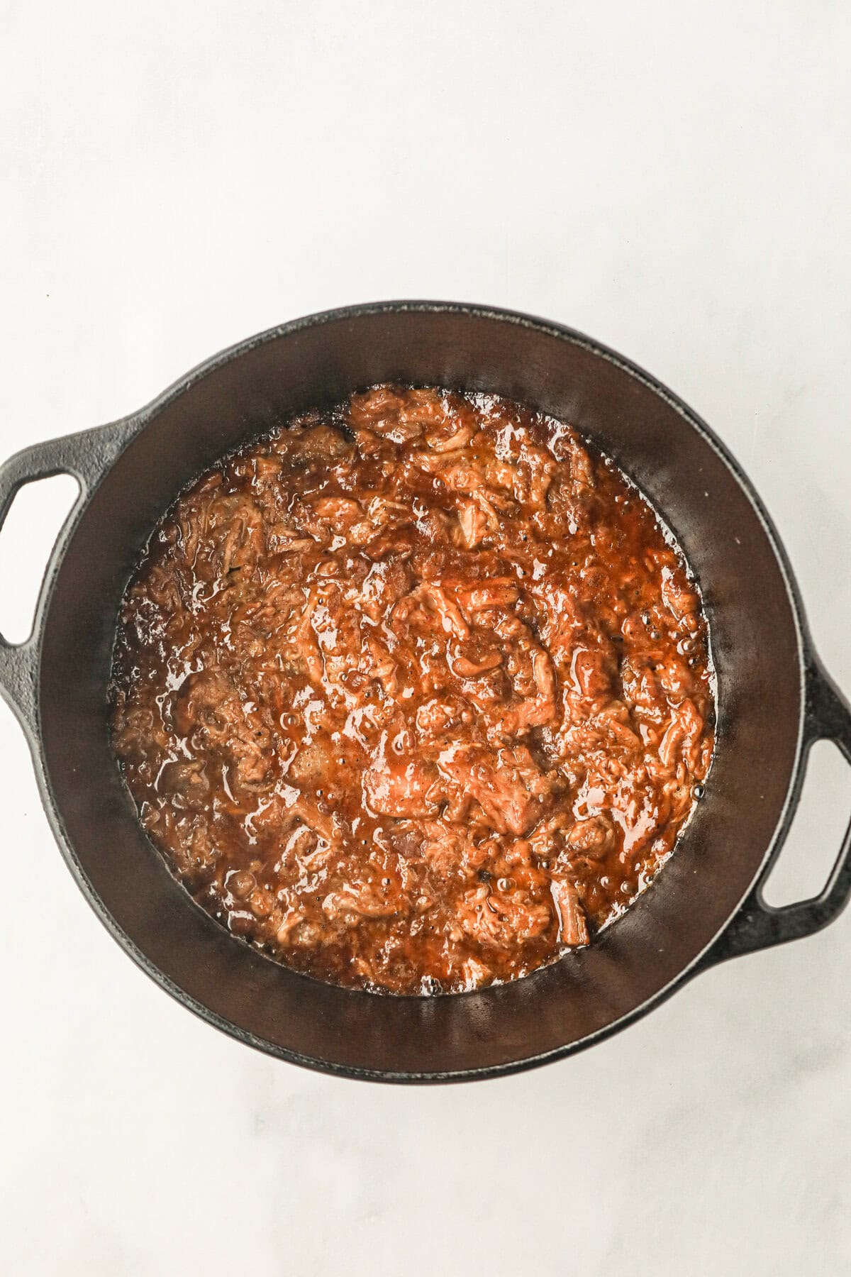 Leftover pulled pork in large pot for Pulled Pork Chili recipe