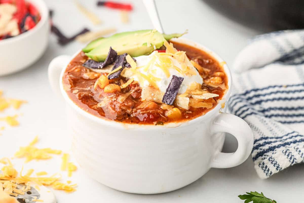 Pulled Pork Chili loaded with toppings in small cup