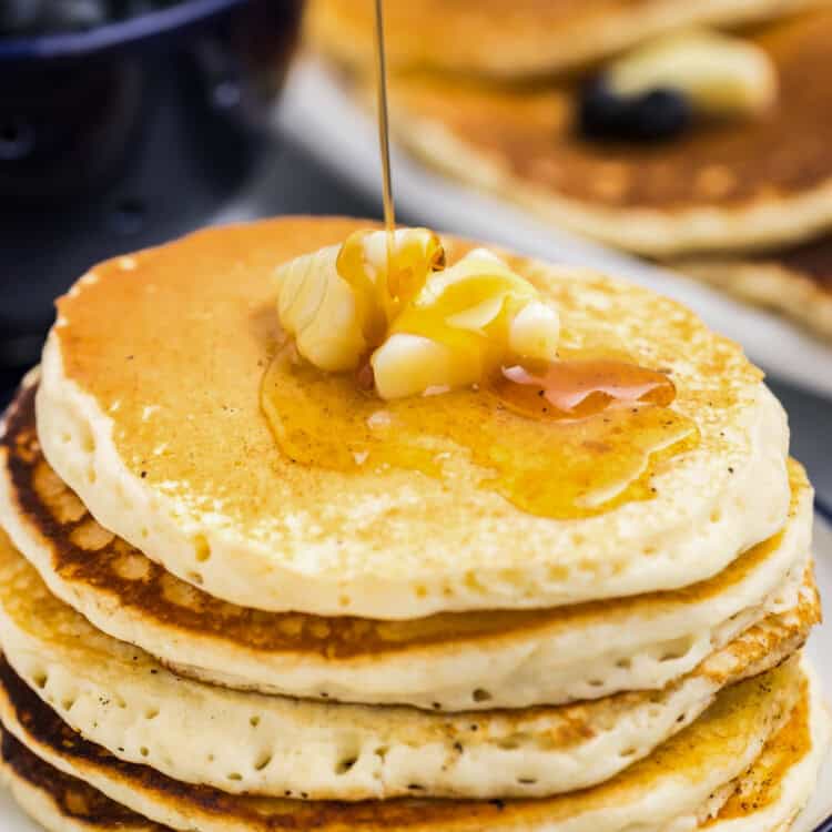 Stack of Blackstone Buttermilk Pancakes with butter and syrup on plate