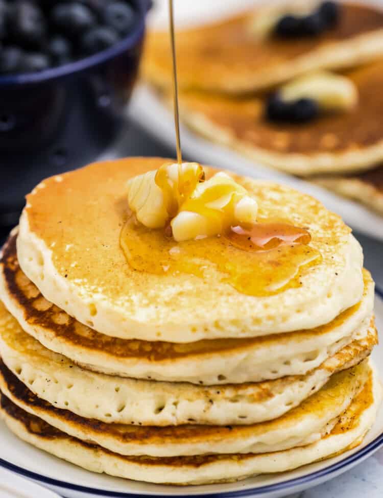 Stack of Blackstone Buttermilk Pancakes with butter and syrup on plate