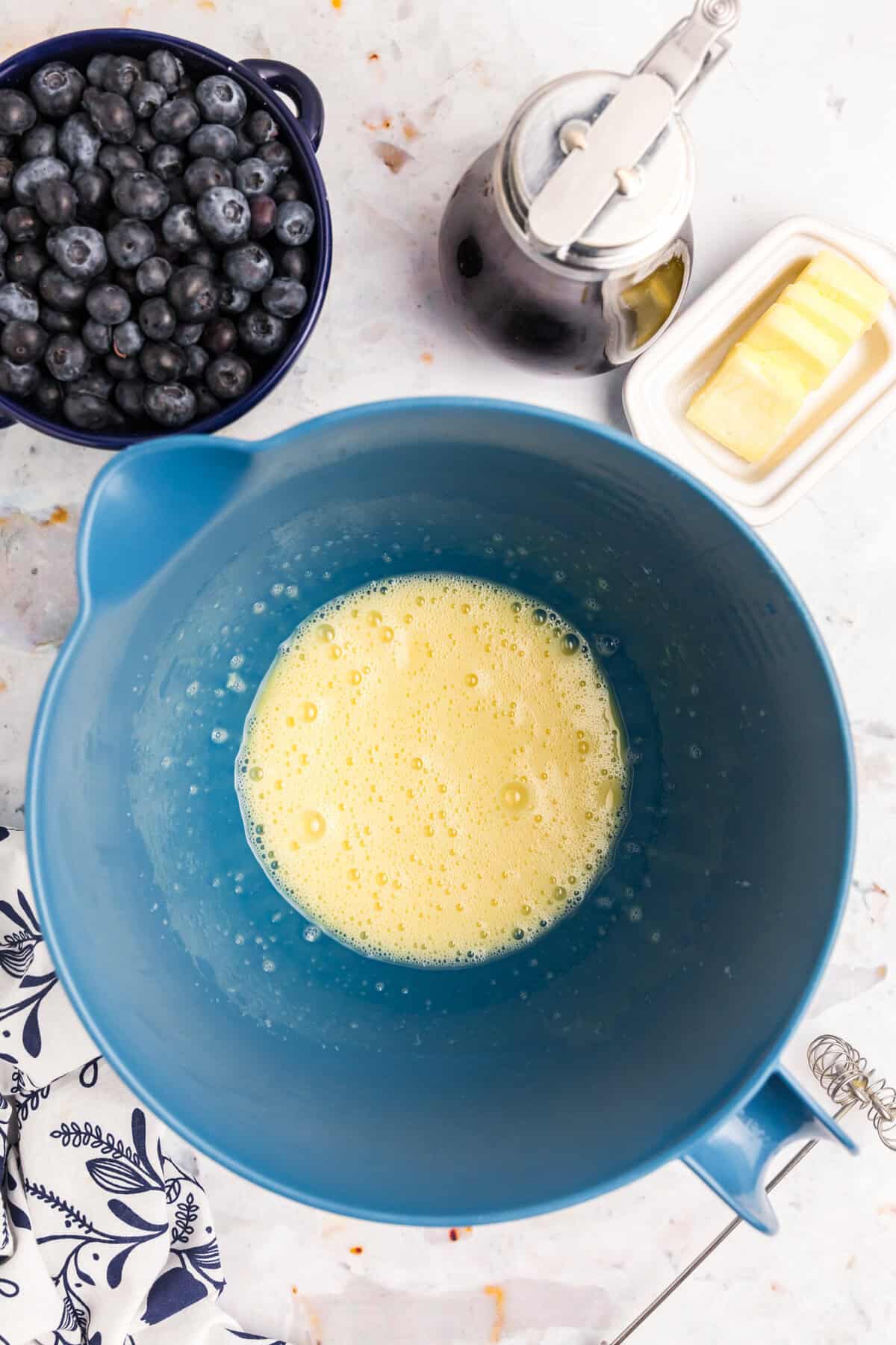 Melted butter in mixing bowl for Blackstone Buttermilk Pancakes recipe