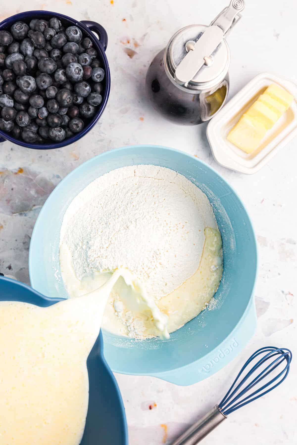 Combining dry and wet ingredients in mixing bowl for Blackstone Buttermilk Pancakes