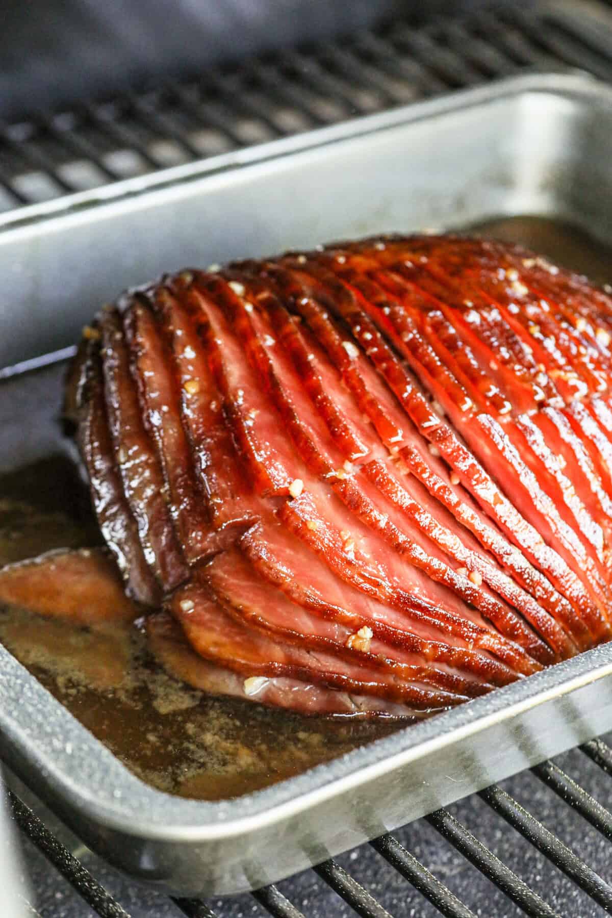 Double Smoked Ham with Glaze in 9x13 baking dish on smoker grill