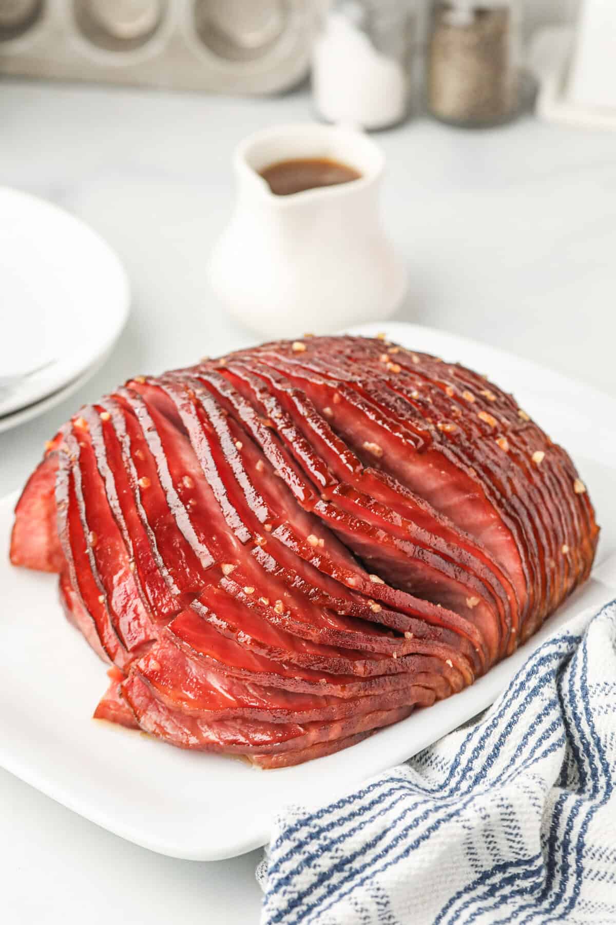 Double Smoked Ham with Glaze fully cooked on white serving platter