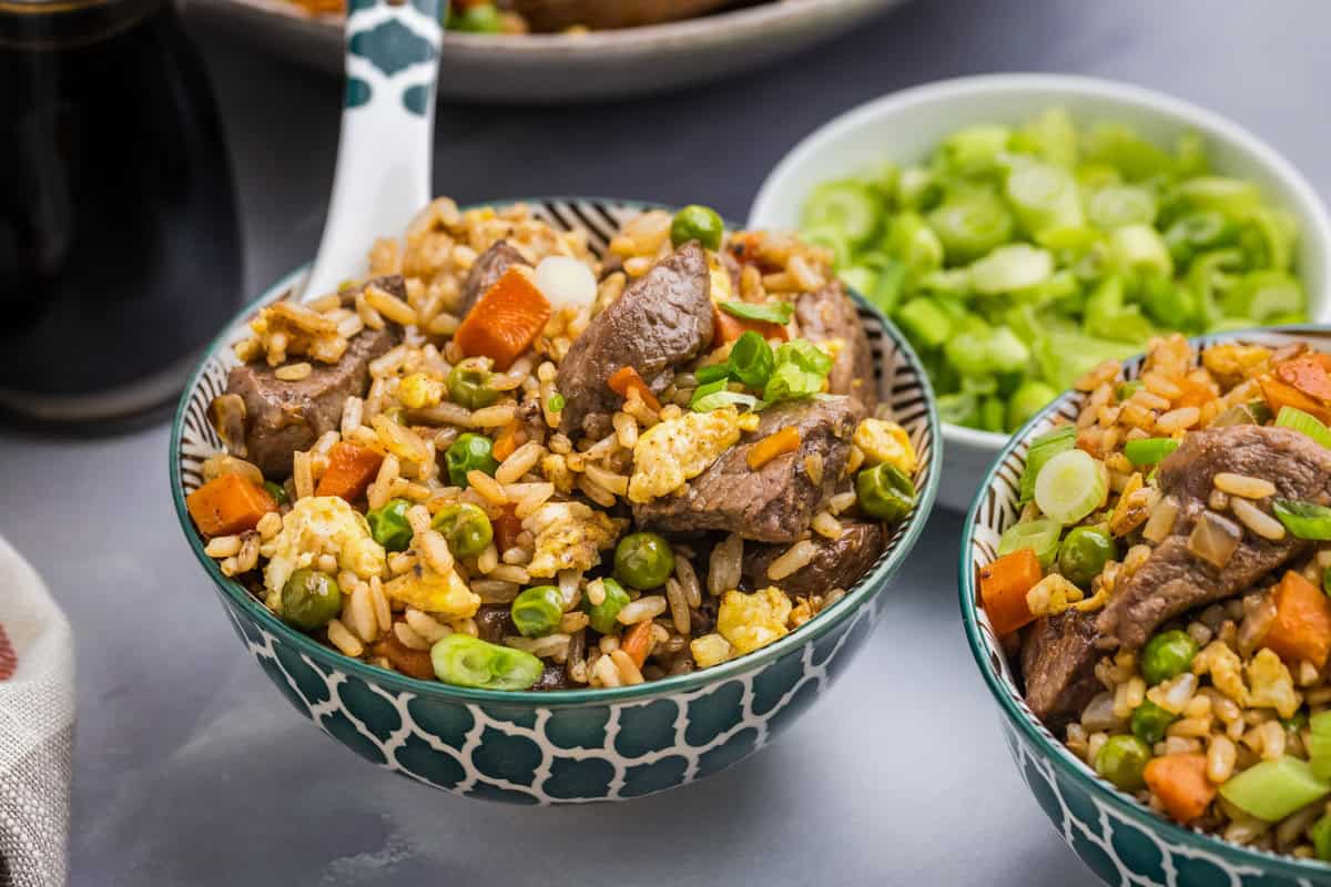 Blue and white patterned bowl with Blackstone Steak Fried Rice in it.