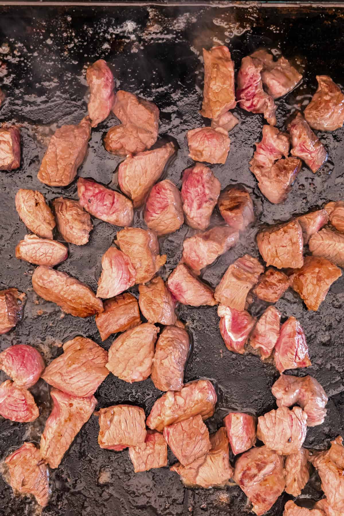 Cooked cubed steak on the Blackstone.