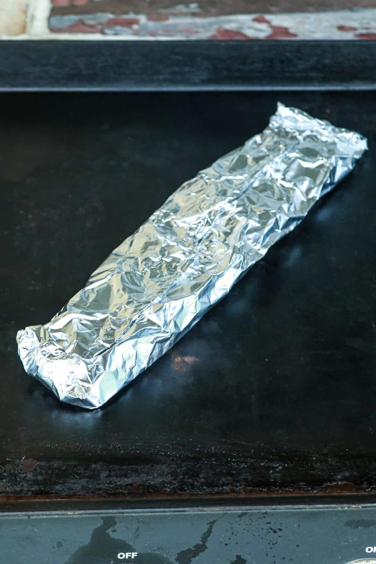 Foil packet on griddle.