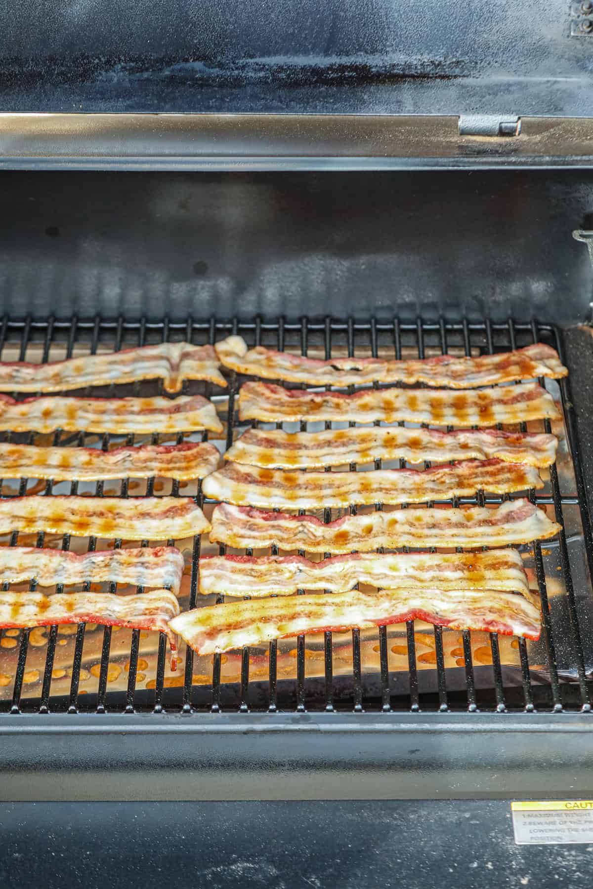 Picture of Smoked Candied Bacon cooking on the smoker.