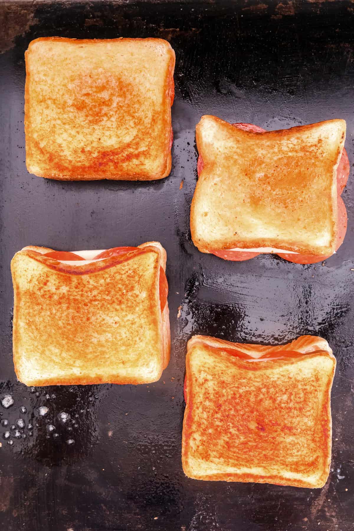 Overhead picture of cooked Blackstone Pizza Grilled Cheese on the Blackstone.