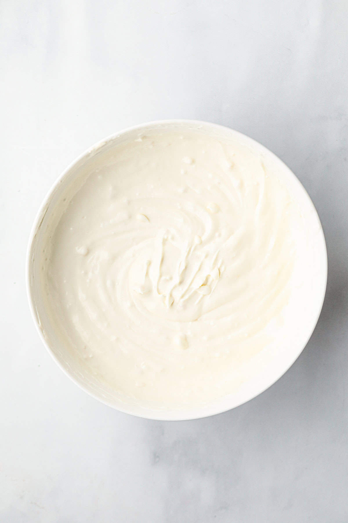 Overhead picture of creamed ingredients in a bowl.