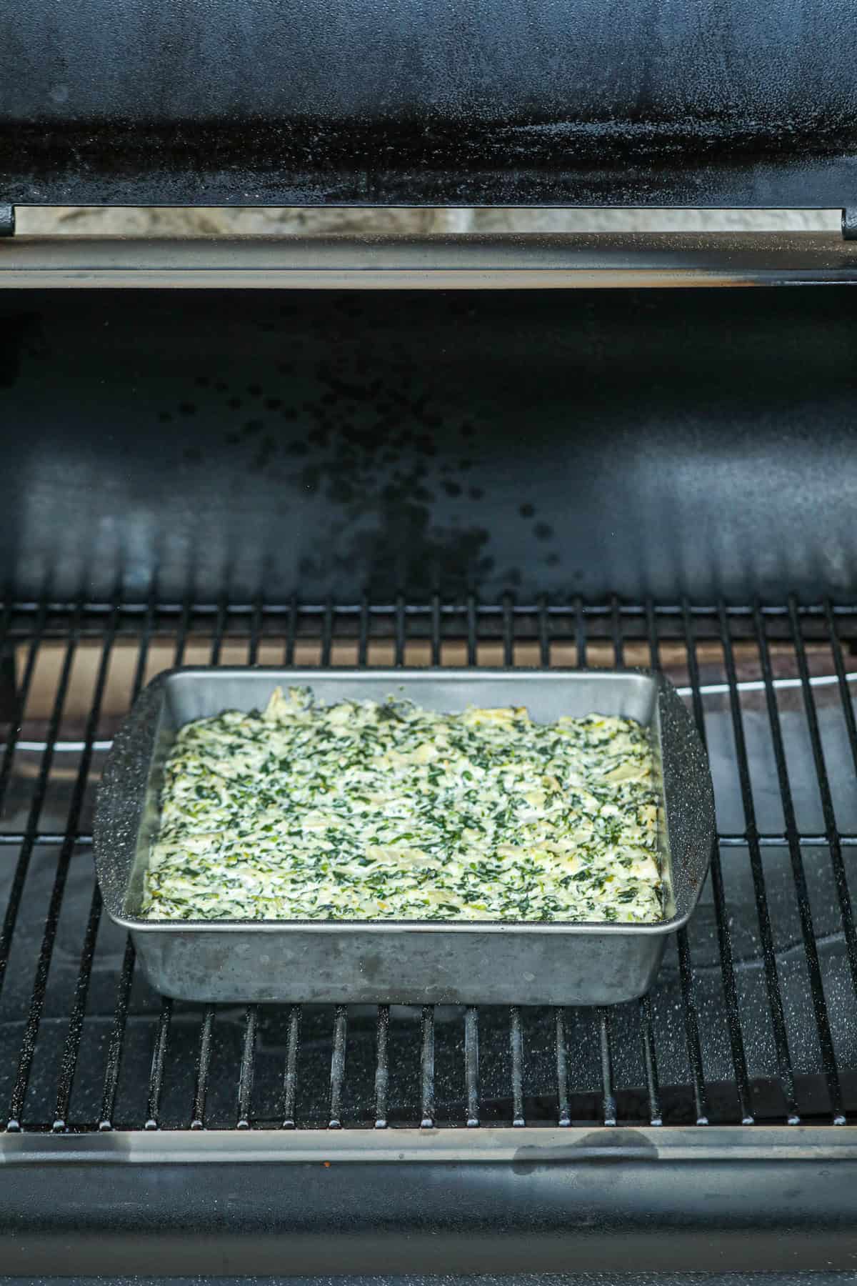 Spinach Artichoke Dip in the smoker cooked.