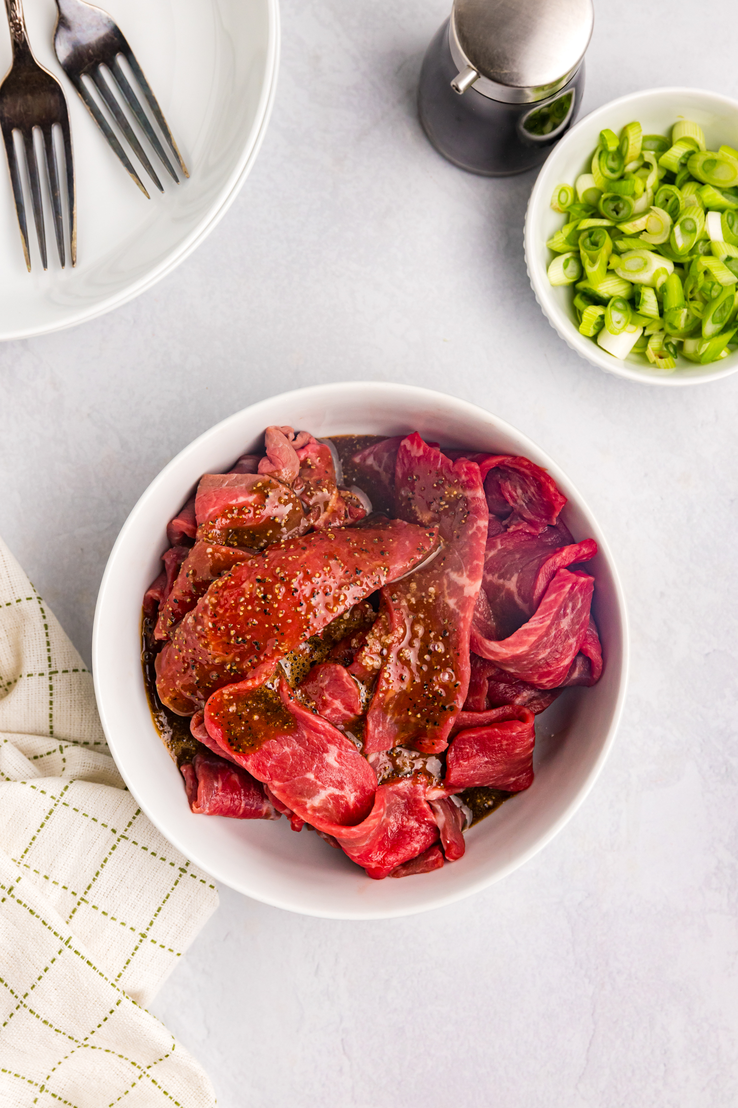 Overhead picture of unseasoned steak in it.