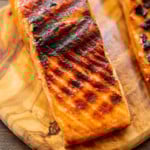 Grilled Salmon filet on wood cutting board