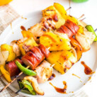 Chicken and Sausage Kebabs on white plate