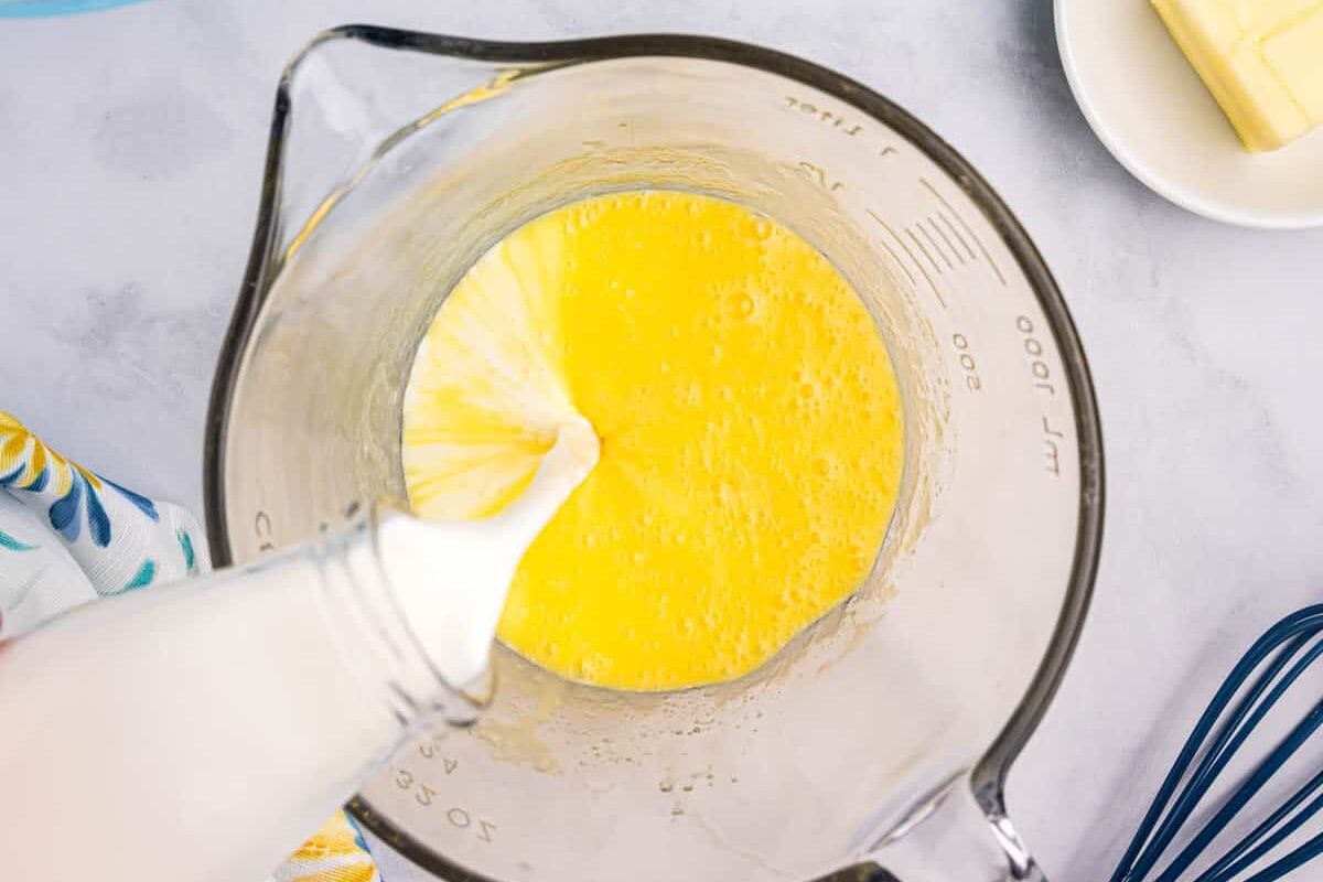 Adding Milk to Egg Mixture for Blackstone Pancakes