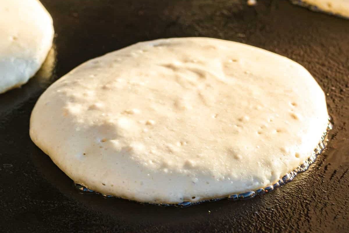 Pancakes on Blackstone Griddle Bubbling and Ready to Flip